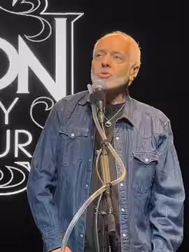 Frampton performing, 2024