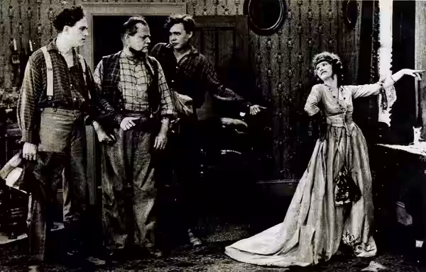 Still from the American silent film Erstwhile Susan (1919) with Anders Randolf, Bradley Barker, Georges Renavent, and Mary Alden, on page 37 of the November 191