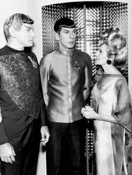 Photo of Mr. Spock with his parents. At left is his father, Sarek, a Vulcan (played by Mark Lenard) and at right, his human mother, Amanda (played by Jane Wyatt