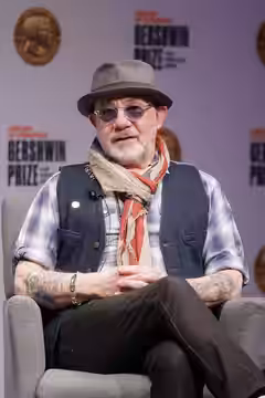 Gershwin Prize for Popular Song honoree Bernie Taupin speaks about his career with Librarian of Congress Carla Hayden during an interview at the Library, March  (2024)