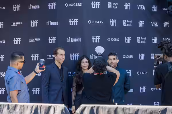Esteban Bigliardi, Berta Marchiori, and Benjamín Naishtat have their photos taken on the red carpet at the Royal Alexandra Theatre for the premiere of the film  (2026)