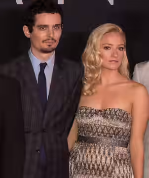 The cast of the film "First Man" pose for a photo after arriving on the red carpet for the premiere at the Smithsonian National Air and Space Museum Thursday, O
