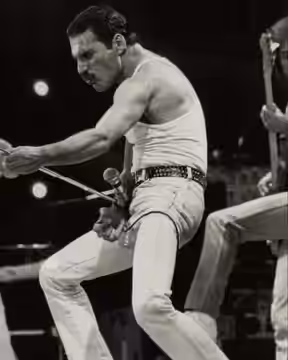 Freddie Mercury performing with the band Queen at Live Aid on 13 July 1985. The concert went on to be known as one of the greatest of all time.