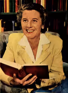 Actress Anne Seymour at her home holding a book (1953)