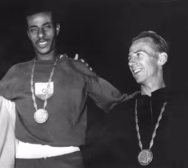 Barry Magee (right) and Abebe Bikila at the 1960 Olympics