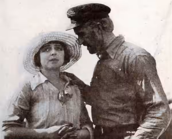 Still from the American film Godless Men (1920) with Helene Chadwick and Russell Simpson, on page 43 of the October 23, 1920 Exhibitors Herald.