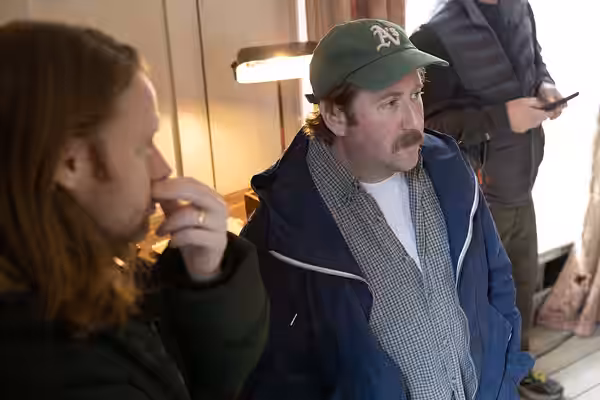 Actor Jim Howick in discussion with producer Matthew Mulot on the set of Ghosts series 2. (2020)