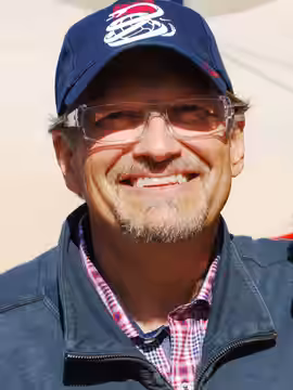 Drew Carey smiles for a photo at the Team USA pep rally before the U.S. vs. Algeria World Cup match on June 23, 2010, in Pretoria, South Africa. [State Departme