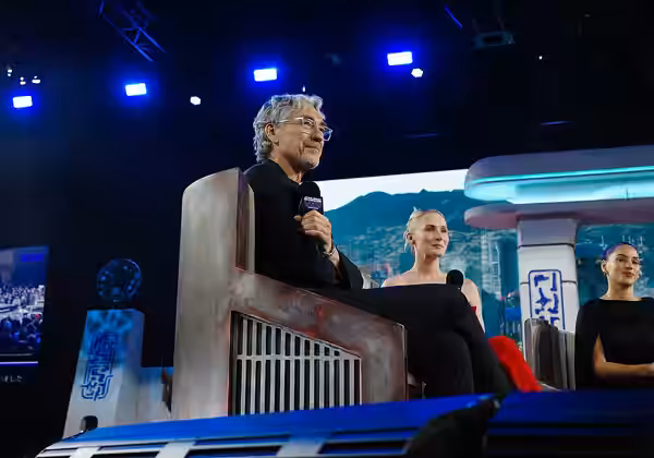 Tony Gilroy speaks on a panel with Genevieve O'Reilly and Adria Arjona at the 2025 Star Wars Celebration in Japan.