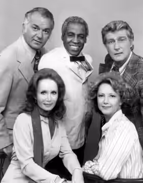 Photo of the Campbells and Tates with Benson from the television program Soap. Standing, from left: Robert Mandan (Chester Campbell), Robert Guillaume (Benson),