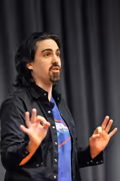 Photo by Brandon Downey. Bear McCreary talking at Google in 2010.