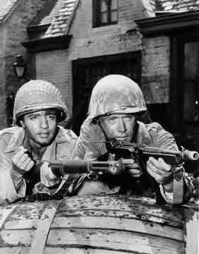 Photo of Sal Mineo (left-in a guest-starring role) and Vic Morrow as Chip Saunders from the television program Combat!. (1965)