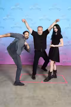 Actors, Charlie Cox and Vincent D'Onofrio and actress Krysten Ritter take a photo together at GalaxyCon Austin in 2023.