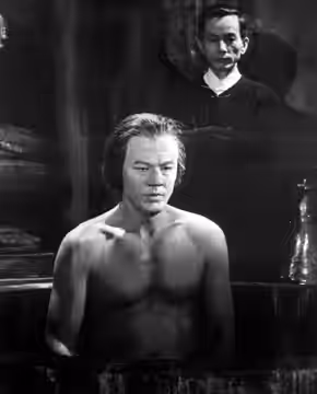 Photo of Robert Culp as an Asian warlord bathing while a member of his security team stands by. The photo is from the television program I Spy and the episode i (1967)