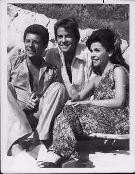 Annette Funicello on a beach with Frankie Avalon (left) and Dick Clark (center). (1977)