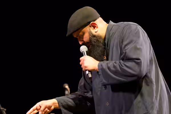 Photo: Azhar Usman, Chicago-based standup comedian on stage at the 2017 Festival of Faiths A nationally acclaimed multifaith festival of music, poetry, art, fil