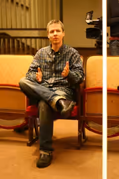 John Cameron Mitchell giving interview to the Czech Television at Mezipatra gay &amp; lesbian film festival 2006 at Kino Světozor, Prague, Czech Republic.