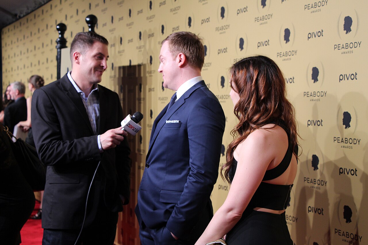 Jeremy Bobb and Jo Armeniox from The Knick talk to Arthur Kade on the red carpet. (2015)