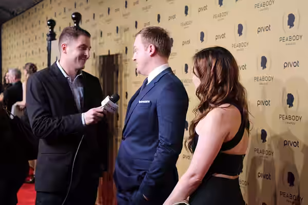 Jeremy Bobb and Jo Armeniox from The Knick talk to Arthur Kade on the red carpet. (2015)
