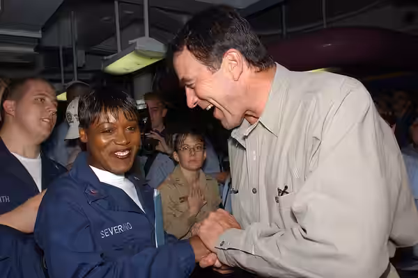 040722-N-4776G-326 Pacific Ocean (July 22, 2004) - Actor Tom Selleck greets USS Ronald Reagan (CVN 76) Sailors during a short visit to the ship before it pulls 