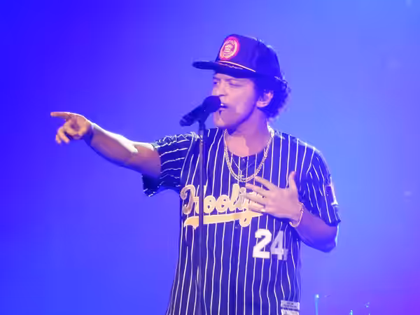 This is a photo of American entertainer Bruno Mars performing live during his 24K Magic World Tour (2017)