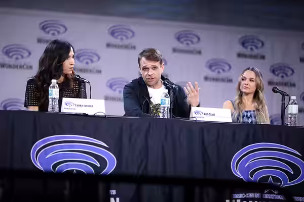 Famke Janssen, Nick Stahl and Madison Iseman speaking at the 2023 WonderCon, for "Knights of the Zodiac", at the Anaheim Convention Center in Anaheim, Californi