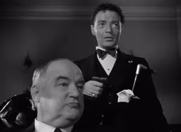 Frame from the 1941 public domain trailer for the Warner Bros. film The Maltese Falcon showing Sydney Greenstreet as Kasper Gutman and Peter Lorre as Joel Cairo