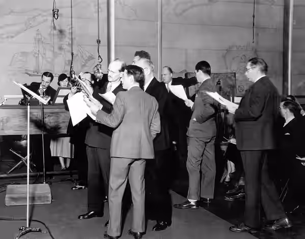 Promotional photograph of cast for The March of Time radio series, CBS Radio (1931–1937). Cursive handwriting on reverse side of still photo reads "March of Tim