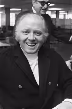 Collectie / Archief : Fotocollectie Anefo Reportage / Serie : De filmmakers van "Een brug te ver" komen aan op Schiphol i.v.m. de filmopnames in Nederland Besch (1975)