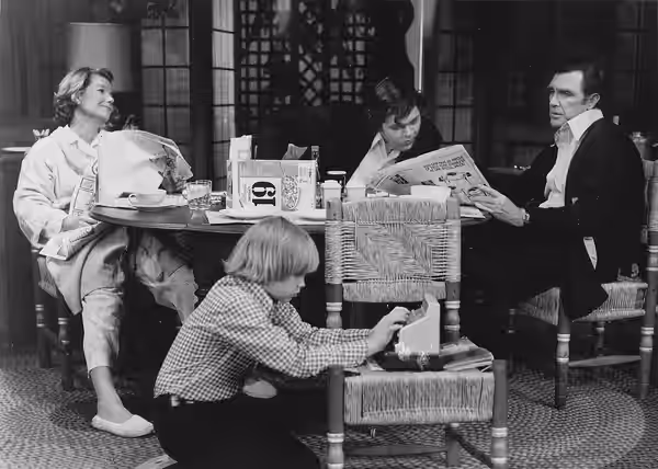 Publicity photo of American actors, (seated at table; L–R) Barbara Bel Geddes, Gary Epp, Robert Lansing and (front) Johnny Doran promoting the 1974 touring thea