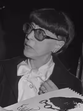 MOVEMENT MONUMENT--Edith Head, Hollywood costume diva, at opening night of retrospective of her work from 1923 to present at Museum of Science and Industry. (1976)