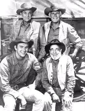 Photo of the main cast of the western television series Wagon Train. Seated from left: Scott Miller, Frank McGrath. Standing from left: John McIntyre, Terry Wil (1862)