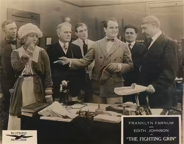 A scene from the American comedy film The Fighting Grin (1918), which played at the Mission Theater, Seattle. Includes Franklyn Farnum and Edith Johnson. Date s