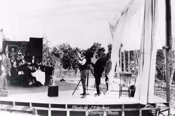 First sequence shooting of the film The Squaw Man in 1913. Cecil B. DeMille, director of the film, is in the center of the picture, wearing boots and a light su