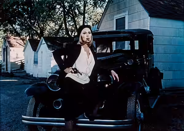 Promo photo of Faye Dunaway as Bonnie Elizabeth Parker in the 1967 film Bonnie and Clyde. Dunaway is emulating a famous photo of the real Bonnie Parker. Printed