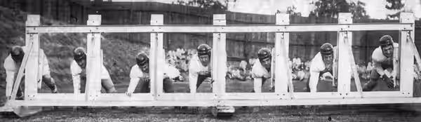 Members of the UCLA Bruins football team during their spring practice, from left to rightː Don Cogswell, Breck Stroschein, Francis Mandula, Gayle Pace, Bruce Ma (1950)