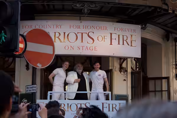 Jack Lowden, Vangelis, and James McArdle watch the Olympic Torch Relay from the Gielgud Theatre, 26 July 2012.