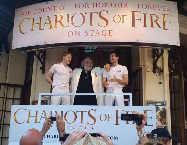 Vangelis and cast members London 26th of July 2012 watch the olympic torch pass the Gielgud Theater.