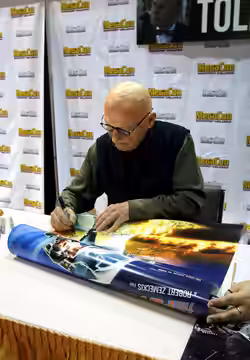 James Tolkan signing a Back to the Future poster at MegaCon Orlando 2019