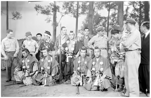 Japanese actors and GIs during the shooting of «The Men Who Tread on the Tiger's Tail», directed by Akira Kurosawa, september 1945. Front row from left to right