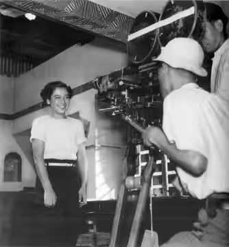 Photo of Setsuko Hara being filmed by Asakazu Nakai and Akira Kurosawa on the set of No Regrets for Our Youth. Taken by Tadahiko Hayashi in 1946.