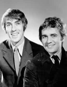 Photo of Peter Cook and Dudley Moore as guests on the television program Kraft Music Hall. The program taped some shows in London for US broadcast in 1969; Moor