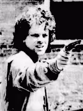 Set photo of actor Brad Dourif playing the role of Robert McEvoy during the filming of w:The Gardener's Son, a 1977 historical drama for which he wrote the scre