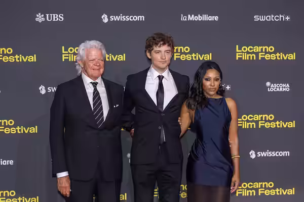 Duwayne Dunham, Josh Whitehouse, Meagan Holder attend the "Le Pays d'Arto" red carpet during the 78th Locarno Film Festival on August 06, 2025 in Locarno, Switz (2000)