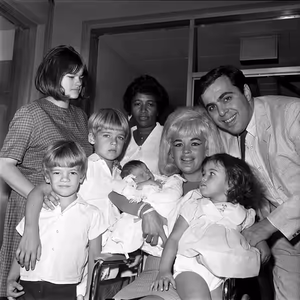 Jayne Mansfield cuddles new son, Antonio Rapheal Cimber Ottaviano as they leave Cedars of Lebanon Hospital. Jayne was accompanied by her husband, Matt, and her  (1965)
