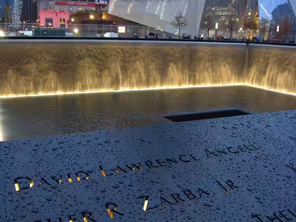 Name of 9/11 victim David Angell inscribed on bronze panel N-1 of the North Pool of the National September 11 Memorial &amp; Museum in Manhattan, as seen on Dec (2011)