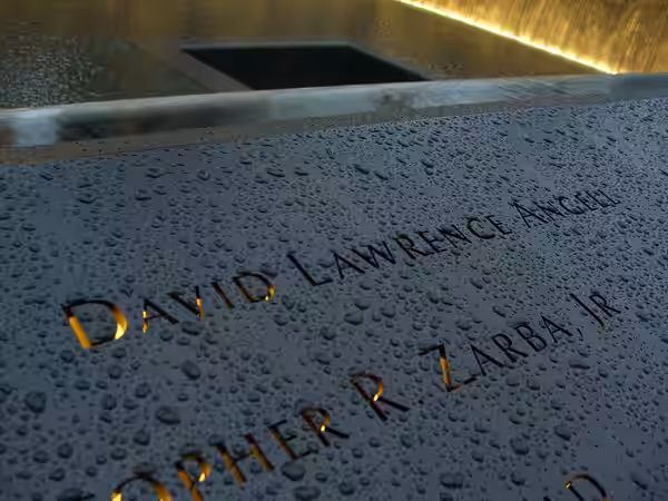 The name of 9/11 victim David Angell inscribed in bronze, along with others on panel N-1 of the North Pool of the National September 11 Memorial &amp; Museum in (2011)