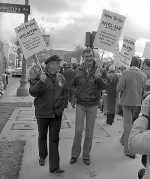 ON THE LINE--Actors Ed Asner, left, Dennis Weaver picket on Wilshire Blvd. as they join in a strike against ad agencies.