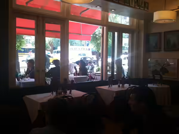 Actors Eliza Dushku and Matthew Bomer (sitting to the left of Dushku), at 10 Downing, a restaurant in Manhattan's West Village, during the June 7, 2011 filming 