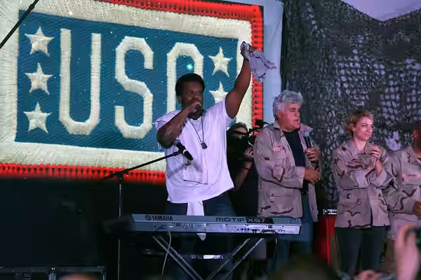 Actor Craig Robinson, comedian Iliza Shlesinger, and and former The Tonight Show host Jay Leno finish up The Today USO Comedy Tour Show held at Bagram Air Field (2014)